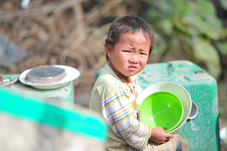 Megrázó fotósorozat hulladékhegyeken élő kínai gyerekekről