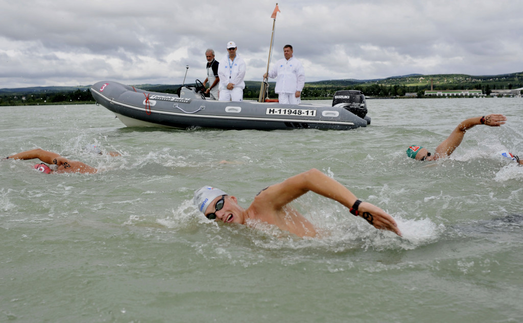 Libor Smolka of Czech Republic, front, competes during the men's 25km open water race of the European Swimming Championships at the lake Balaton offshore of Balatonfuered, Hungary, Saturday, Aug. 7, 2010. (AP Photo/Bela Szandelszky)