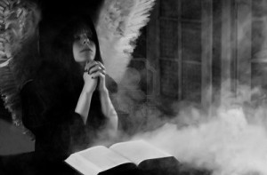 7995073-angel-with-white-wings-praying-with-mysterious-book-opened-and-smoke-in-the-air