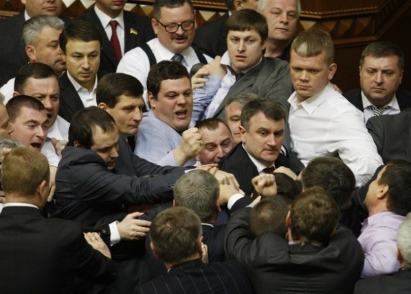 Ukrainian opposition and majority deputies fight on March 19, 2013 on whether to speak Ukrainian or Russian in the parliament in Kiev. Before The brawl started after the leader of the ruling Regions Party faction, Oleksandr Yefremov, delivered a speech in Russian. Nationalist Svoboda faction members then hissed at Yefremov and chanted "Ukrainian," demanding that he speak Ukrainian.              AFP PHOTO/ STR