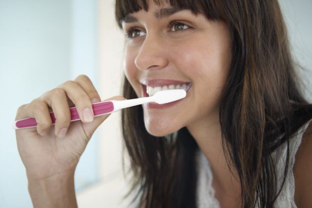 Woman Brushing Her Teethe
