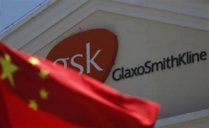 A Chinese national flag is seen in front of a GlaxoSmithKline office building in Shanghai