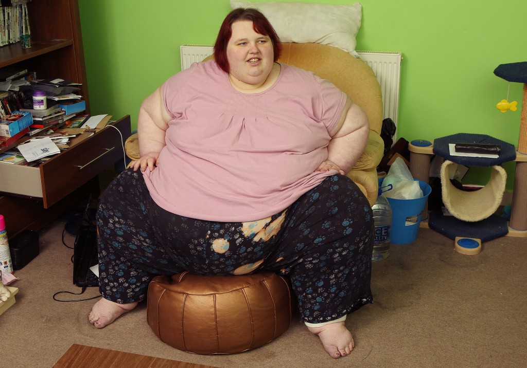 Georgia Davis in her flat in South Wales, in the chair that she has become a virtual prisoner in.