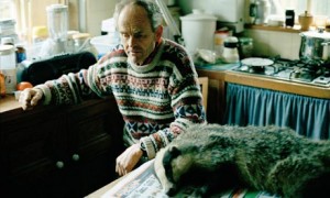 Roadkill expert Arthur Boyt at home with a dead badger
