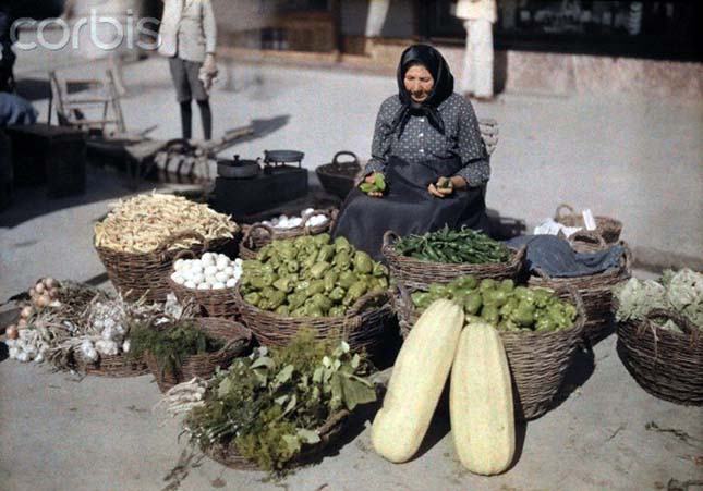 A peasant woman sells her produce and eggs at the local market