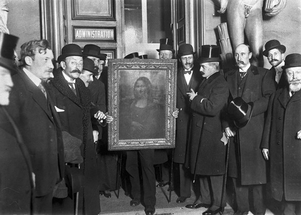 People gather around the Mona Lisa painting in Paris, France, in January 1914