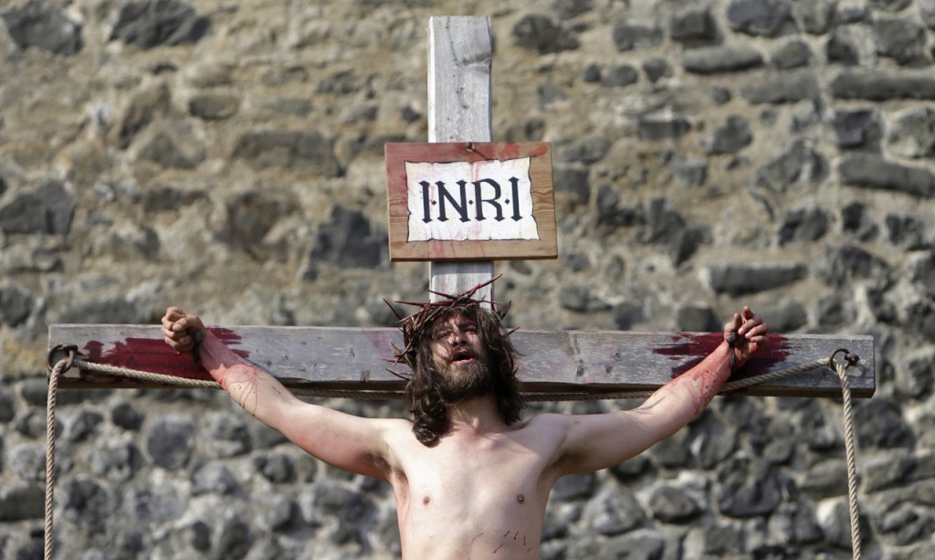 An actor portraying Jesus Christ performs the crucifixion scene during "the Passion of Christ" play in Ceska Lipa