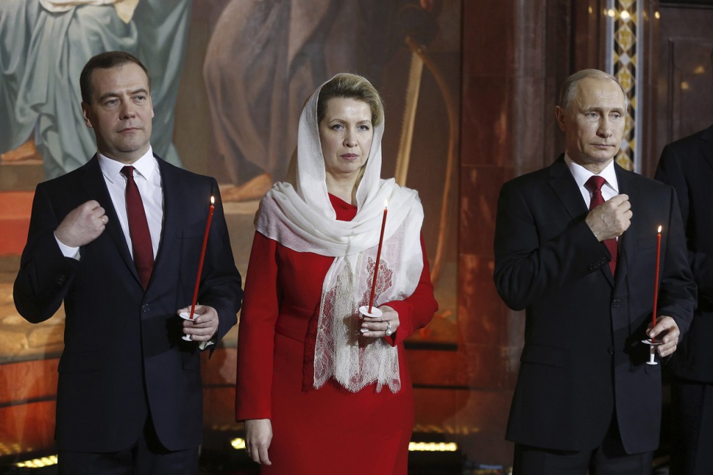 Russian President Putin, PM Medvedev and his wife Svetlana attend an Orthodox Easter service in the Christ the Saviour Cathedral in Moscow