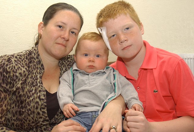 Boy saves mum and baby brother from dog attack
