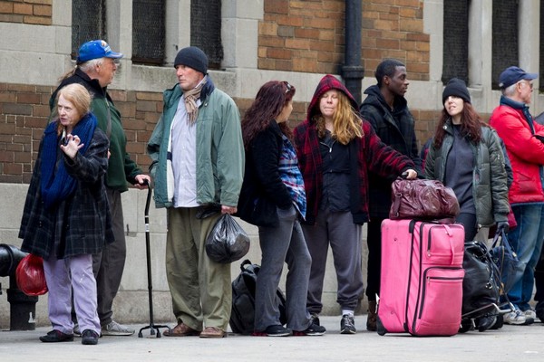 Richard Gere lines up with other homeless actors outside a church in NYC.