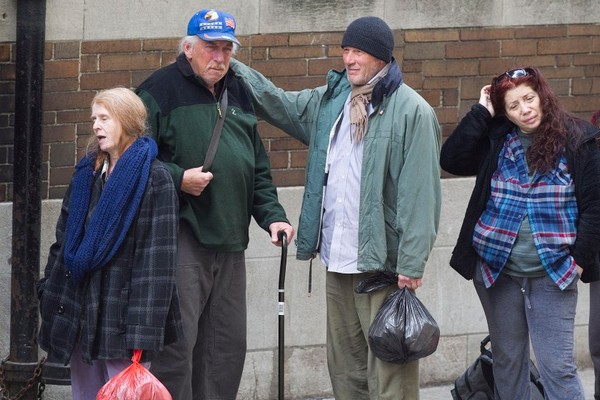 Richard Gere lines up with other homeless actors outside a church in NYC.