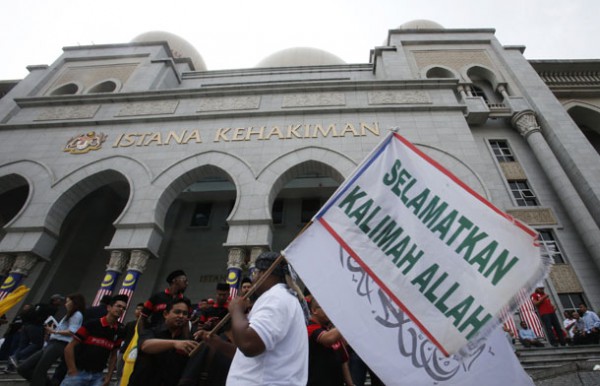 uslim demonstrator displays a flag outside Malaysiaís Court of Appeal in Putrajaya