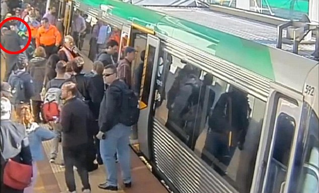 train passengers rescue a man trapped between train and platform in Australia