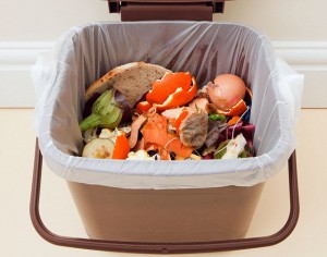 UK. Food waste in indoor food waste bin with lid open indoors