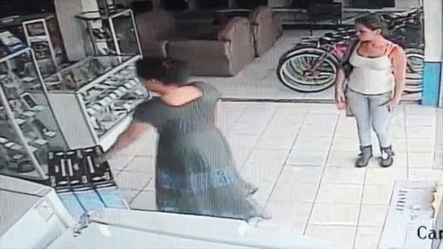 VID: Cops Hunt Thief Who Stuffed TV Between Her Legs