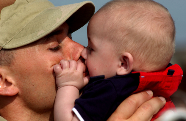 A-soldier-meets-his-infant-son.