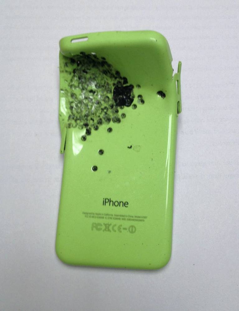 The damaged iPhone with the shotgun marks. A father of two who was gunned down in a revenge attack after he challenged vandals terrorising his neighbourhood cheated death when the bullets hit his iPhone. Daniel Kennedy was blasted with a sawn off double barrelled shotgun on a public footpath as he remonstrated with teenagers who had been intimidating locals and who had switched off the local water supply as a prank but miraculously Mr Kennedy's life was saved with the bullets smashed into his mobile phone which he kept in his pocket and deflected them away from his vital organs. He was able to get to his feet and stagger towards a block of flats where he lived and raise the alarm. Police later found the damaged iPhone which fell out of the victim's pocket as he tumbled to the ground, with tests showing it took the brunt of the shotgun blast. Details of the shooting emerged as teenager Ryan Duggan from Widnes, Cheshire was convicted of attempted murder and  possession of a firearm with intent to endanger life following a three day trial at Chester Crown Court.