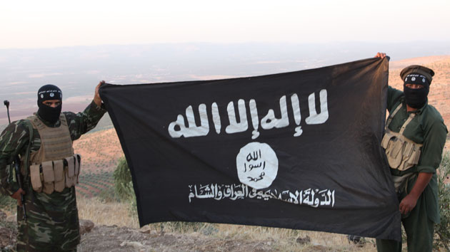 Oct 17, 2013 - Aleppo, Syria - ISIS fighters holding the Al-Qaeda flag with 'Islamic State of Iraq and the Levant' written on it. on the frontline. Islamic State of Iraq and the Levant aka ISIS. The group An-Nusra Front announced its creation January 2012 during the Syrian Civil War. Since then it has been the most aggressive and most effective rebel force in Syria. The group has been designated as a terrorist organization by the United Nations. April 2013, the leader of the ISIS released an audio statement announcing that Jabhat al-Nusra is its branch in Syria. (Credit Image: © Medyan Dairieh/ZUMA Wire/ZUMAPRESS.com)