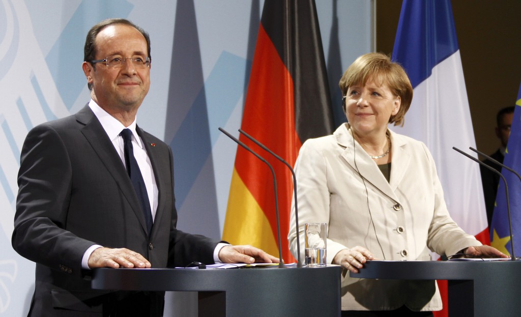 German Chancellor Merkel and French President Hollande address a news conference after their talks in the Chancellery in Berlin