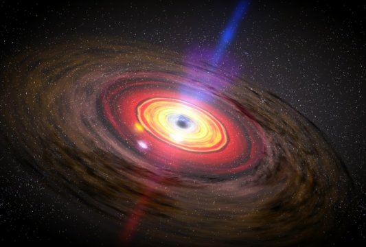 Túlméretezett fekete lyuk uralja egy ősöreg galaxis centrumát