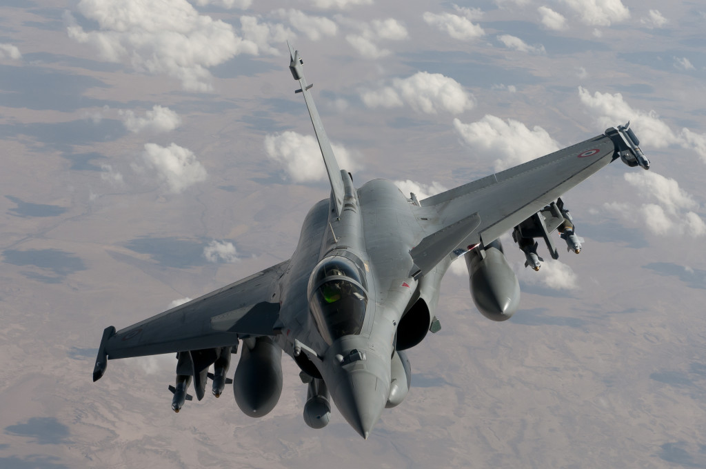 A handout picture taken on October 17, 2014 by the French Army and released on October 21, 2014 by French Army Communications body ECPAD (Establishment of Communication and Audiovisual Production of Defense) shows a Rafale fighter jet equiped with 4 laser guided bombs GBU-12 flying over Iraq on a reconnaissance mission after taking off from the Al-Dhafra base in the United Arab Emirates. French jets carried out on October 19, 2014 an air strike against two pick pick up trucks in the region of Tikrit, successfully destroying their target using 3 laser-guided bombs GBU-12, as part of the "Chammal" operation. France has increased its equipment with 3 more Rafale up to 9 Rafale fighter jets, after having mobilized one c135 refueling aircraft and an Atlantique 2 maritime patrol airplane, along with a warship deployed to the Persian Gulf to boost the fight against Islamic State in Iraq.  AFP PHOTO / ECPAD / EMA /ARMEE DE L'AIR = RESTRICTED TO EDITORIAL USE - MANDATORY CREDIT "AFP PHOTO / ECPAD / EMA /ARMEE DE L'AIR" - NO MARKETING NO ADVERTISING CAMPAIGNS - DISTRIBUTED AS A SERVICE TO CLIENTS - TO BE USED WITHIN 30 DAYS FROM 10/21/2014 =