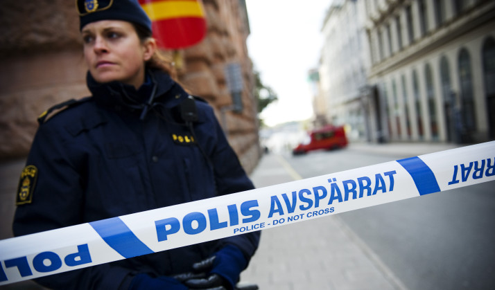 A police officer stands guard as a police and fire department team inspects a street and building where a suspicious package was found, next to the Rosenbad government office, in Stockholm, on October 13, 2011. Police said they had evacuated parts of Sweden's government building, which houses Prime Minister Fredrik Reinfeldt's offices, after a suspicious package triggered a bomb scare. AFP PHOTO/JONATHAN NACKSTRAND (Photo credit should read JONATHAN NACKSTRAND/AFP/Getty Images)