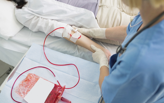 Nurse removing the transfusion