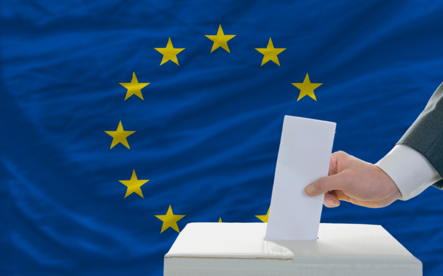 man voting on elections in europe in front of flag