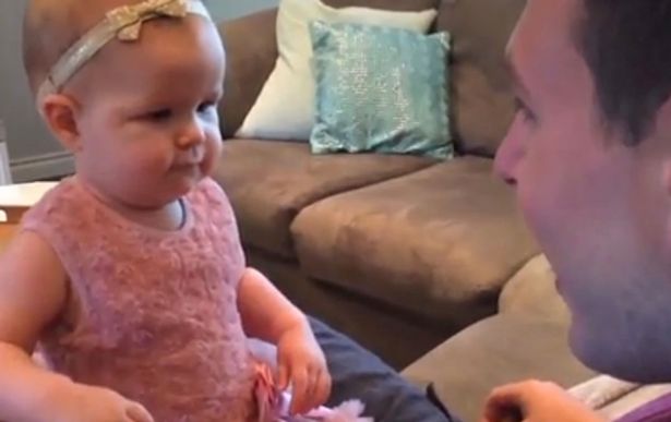Baby-girl-reacts-badly-after-dad-shaves-off-beard
