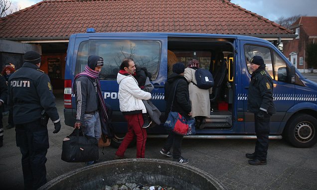 PADBORG, DENMARK - JANUARY 06: Danish police escort a family from Syria seeking asylum in Denmark after finding them while checking the identity papers of passengers on a train arriving from Germany on January 6, 2016 in Padborg, Denmark. Denmark introduced a 10-day period of passport controls and spot checks on Monday on its border to Germany in an effort to stem the arrival of refugees and migrants seeking to pass through Denmark on their way to Sweden. Denmark reacted to border controls introduced by Sweden the same day and is seeking to avoid a backlog of migrants accumulating in Denmark. Refugees still have the right to apply for asylum in Denmark and those caught without a valid passport or visa who do not apply for asylum are sent back to Germany. (Photo by Sean Gallup/Getty Images)