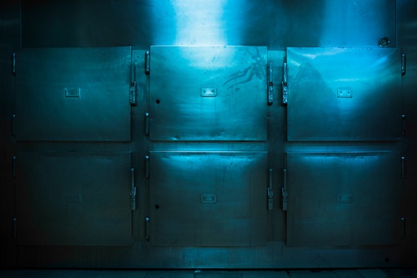Grungy and high contrast photo of morgue trays