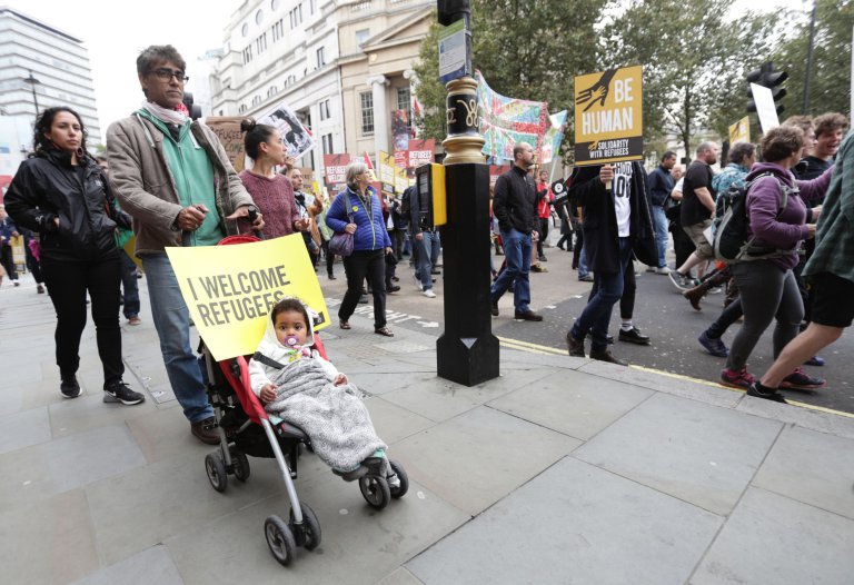 People march through central London as they take part in a protest rally organised by Solidarity with Refugees in a bid to urge the Government to take more action on the migrant crisis. PRESS ASSOCIATION Photo. Picture date: Saturday September 17, 2016. See PA story PROTEST Refugees. Photo credit should read: Yui Mok/PA Wire