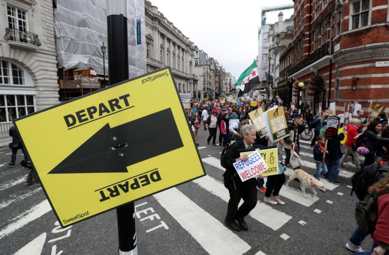 People march through central London as they take part in a protest rally organised by Solidarity with Refugees in a bid to urge the Government to take more action on the migrant crisis. PRESS ASSOCIATION Photo. Picture date: Saturday September 17, 2016. See PA story PROTEST Refugees. Photo credit should read: Yui Mok/PA Wire