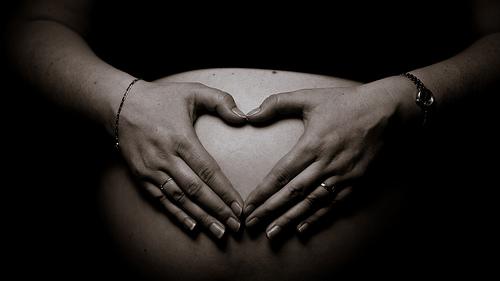 pregnant-woman-touching-stomach